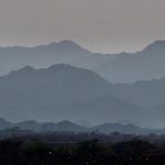 Panorama of mountain layers in the evening light in the Hajar Mountains in Oman. Photo by Pete Bracey
