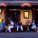 People relax outside a bar in Krakow, Poland. photo by Pete Bracey